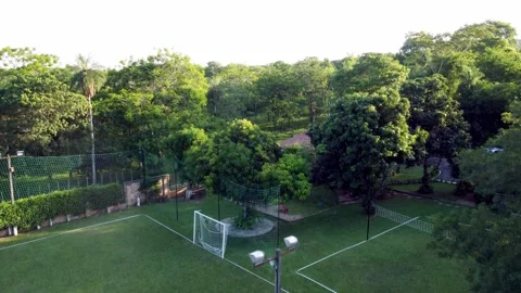 Drone Rising Over Backyard Sports Field in Green Nature 4k Stock Footage 321171053