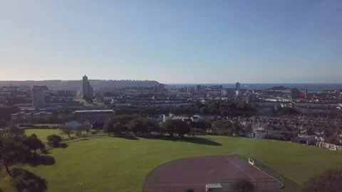 Drone Rising Over Central Park with Plymouth City Centre and Sea View 4k Stock Footage 320946463