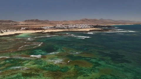 Drone rising over crystal clear seas Canary Islands Stock Footage 343410918