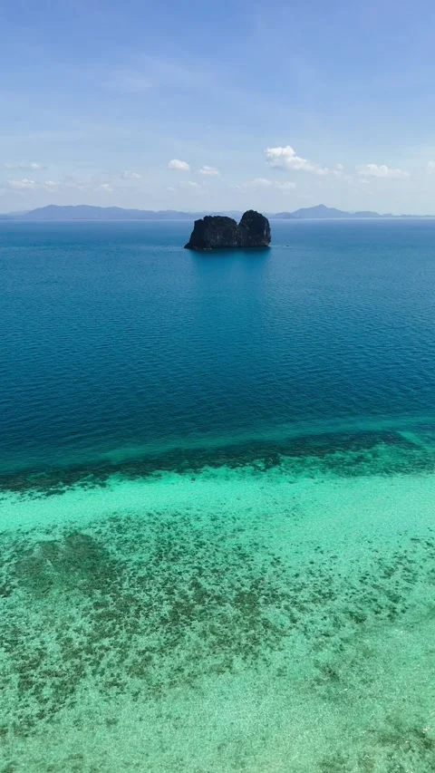 Drone rising over karst mountain and turquoise/deep blue waters, Koh Ngai – 4K Video stock 325022370