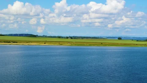 Drone rising up over lake and countryside Stock Footage 242595264
