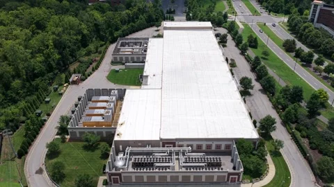 Drone Rising Over a Modern Data Center with Cooling Fans and Diesel Generators Stock Footage 340381210