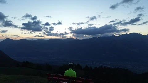 Drone Rising Over Road Cyclist to Reveal Mountain Valley Stock Footage 344584549