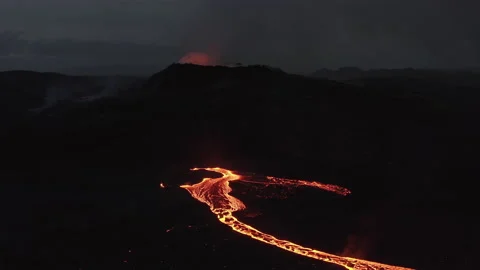 Drone Rising Over Stream Of Molten Lava Flowing From Volcan Stock Footage 168769692
