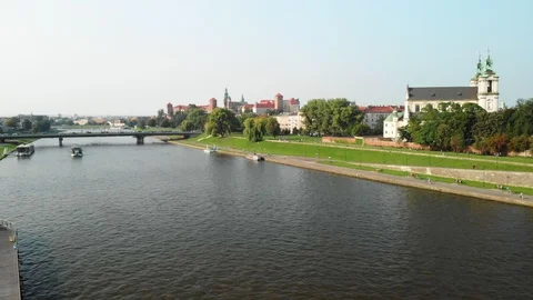 Drone rising over Vistula River and Church of St Michael the Archangel, Poland Stock Footage 99323557