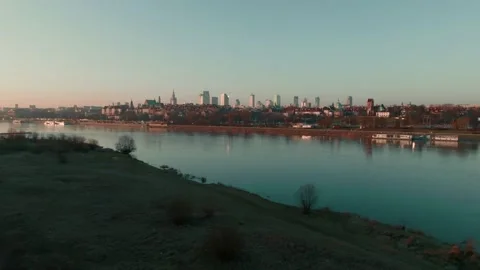Drone rising over wide Wisla river to reveal beautiful peaceful Warsaw cityscape Stock Footage 172059080