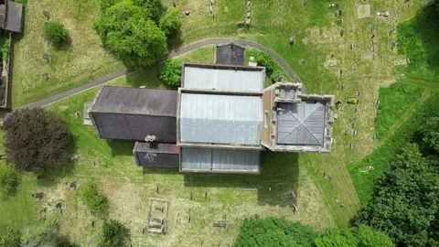 Drone rising in plan view over St mary's Church Mentmore Stock Footage 242600438