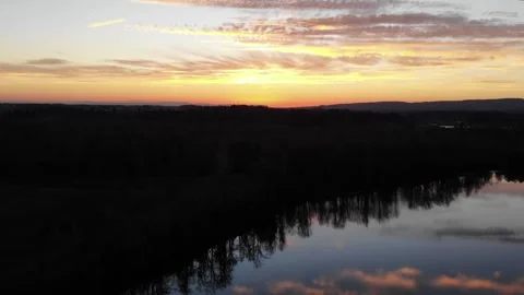Drone Rising Sunset Over River Vídeos de archivo 328382799