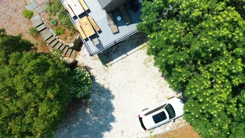 Drone Rising to Top-Down Aerial View of House, Driveway, Car, and Trees Stock Footage 319815139
