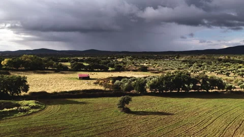 Drone rising toward approaching storm over Mediterranean landscape Stock Footage 326446022