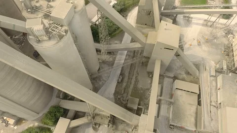 Drone rising within massive industrial structure used for limestone mining Video stock 116246686