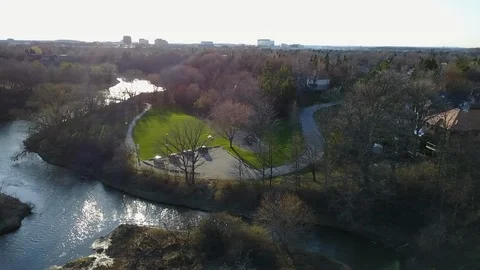Drone - River runs through Urban Park Stock Footage 95720736