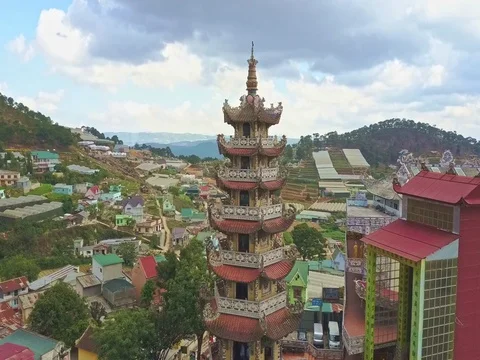 Drone Rotates around Buddhist Temple Pagoda against Sky Stock Footage 77052948