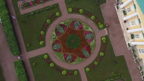 Drone rotating above geometric flower composition Video stock 321896876