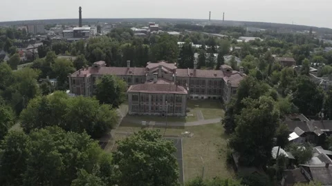 Drone rotating around historic architecture and trees Видео 332457268