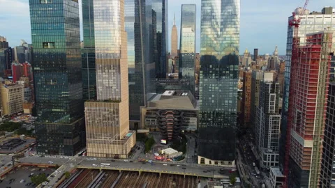 Drone rotating backwards in front of the Hudson Yards skyline, sunset in NYC Stock Footage 320448405