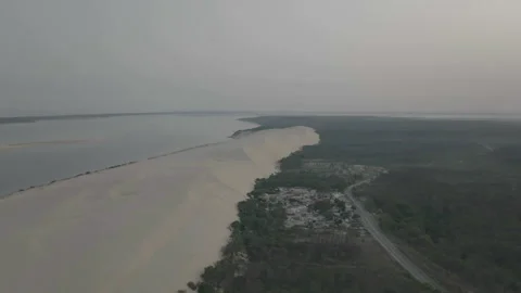 Drone rotating at Dune du Pilat with dune left and forest right, France Stock Footage 333108261