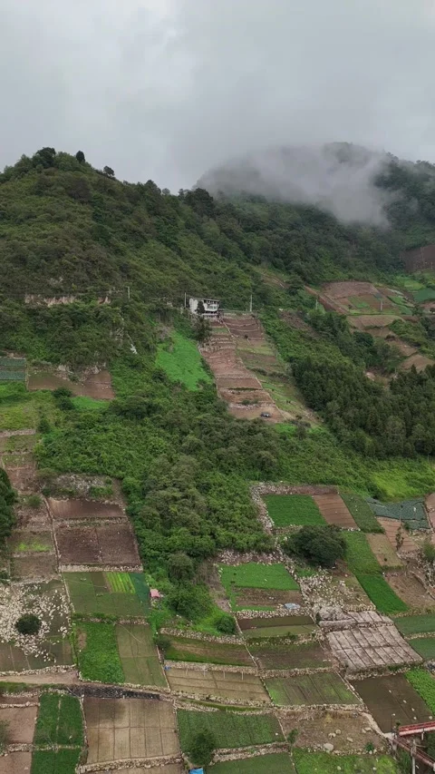 Drone Rotating Over Patchwork Vegetable Farms on Zunil Volcano Stock Footage 343580908