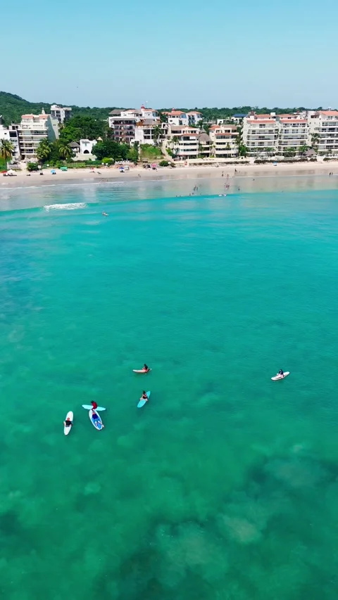 Drone Rotating over Surfers in Punta Mita, Nayarit. Mexico Stock Footage 295798775