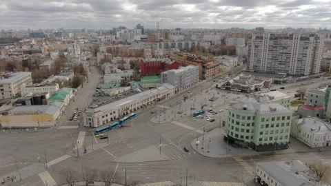 Drone rotating right above large city intersection Stock Footage 323576052