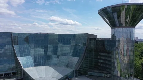 Drone rotating toward office complex and ascending Stock Footage 325985621