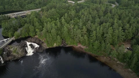 Drone Rotating Upwards to show High Falls and surrounding area (Bracebridge, Stock Footage 314233789