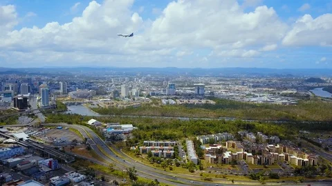 Drone in Santurce watching a jet fly into Puerto Rico airport Stock Footage 102167279