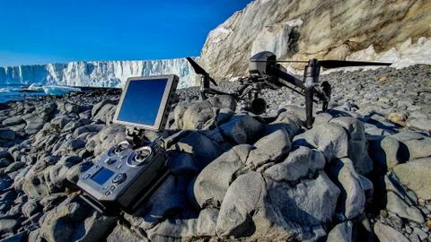 Drone sat on rocks with glacier in Antarctica Stock Photos