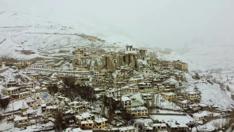 Drone scene of Lamayuru Monastery wrapped in soft snowflakes. Stock Footage 310661289