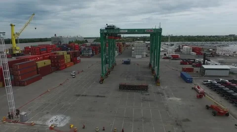Drone Scene over containers and flying besides a huge crane on an import export Vídeo Stock 59941626