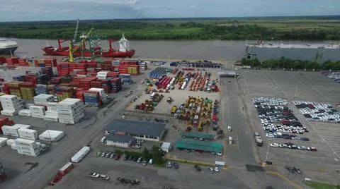 Drone scene over an import export harbour, Containers, cargo ship, cars and rive Vídeo Stock 62834639