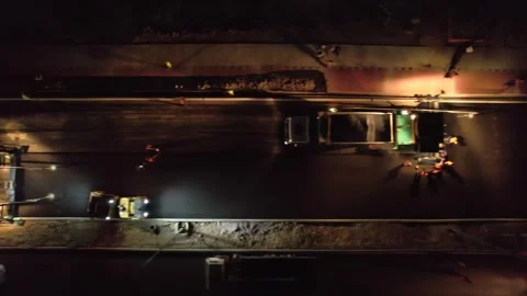 Drone on a section of a city road under repair at night Stock Footage 311805737