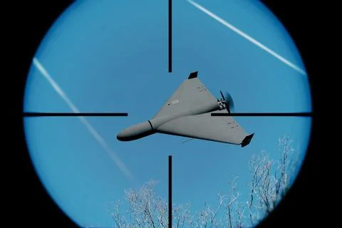 A drone seen through an optical sight against the background of the sky. 写真素材