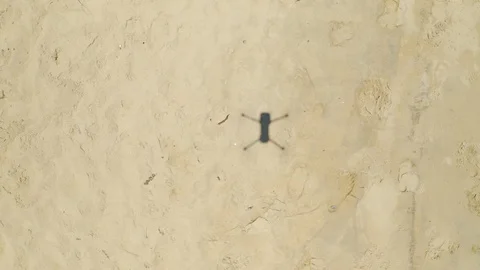 Drone shadow on the sand beach Video stock 108421556