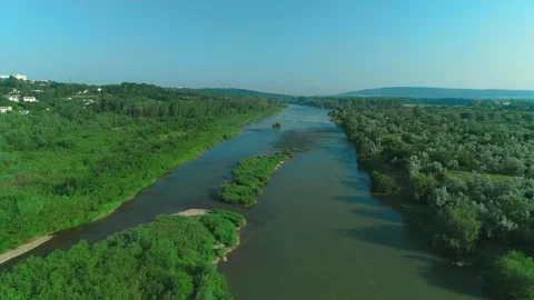 Drone shoot of the bridge over the river in a cottage village in the forest. 4K. Stock Footage 113289074