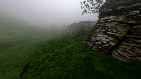 Drone shoot falling over the clouds to the greenpath Stock-Footage 312010309