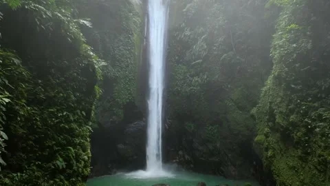 Drone shoot. Waterfall hidden in tropical rainforest jungle Stock Footage 245310742