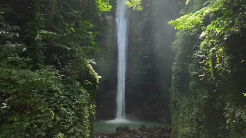 Drone shoot. Waterfall hidden in tropical rainforest jungle,  falling water Stockbeeldmateriaal 248484207