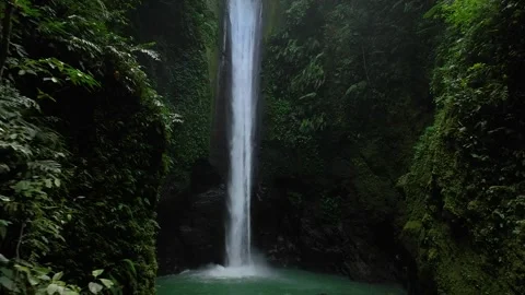 Drone shoot. Waterfall hidden in tropical rainforest jungle,  falling water Stock Footage 253820436
