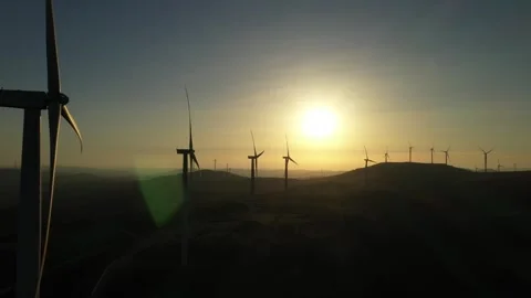 Drone shoot of wind turbines rotating at sunset. Stock Footage 247641667