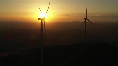 Drone shoot of wind turbines rotating at sunset. Stock Footage 247641686