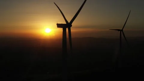 Drone shoot of wind turbines rotating at sunset. Stock Footage 247641728