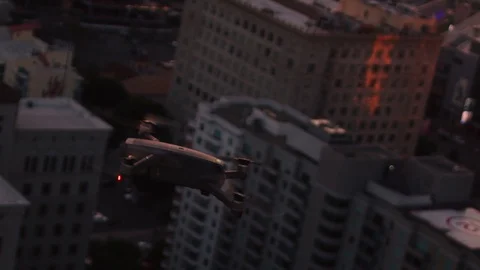 Drone shooting aerial sunset over Downtown LA, urban view in golden light Stock Footage 128543473