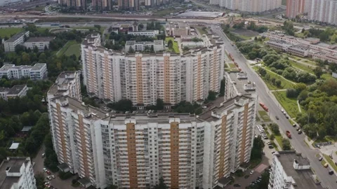 Drone shooting of a city with two multi-storey building. Drone moving around Video stock 142421588