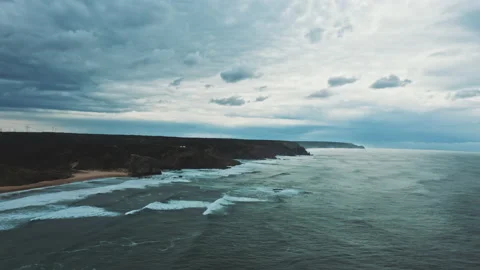 Drone shoots the caves and cliffs on wild coastal area Stock Footage 203595567
