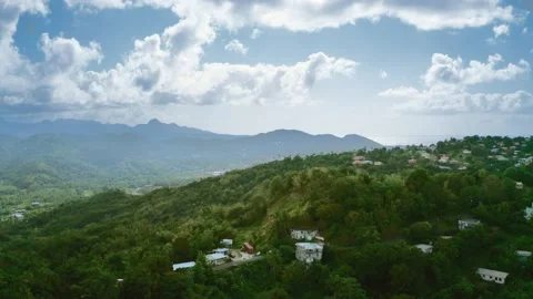 Drone shoots mountains with dense forest and houses  (Rodney Bay, Saint Lucia) Video stock 131983292