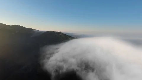 Drone shoots mountains under thick clouds in the morning (Malibu Canyon, Monte Video stock 126678869