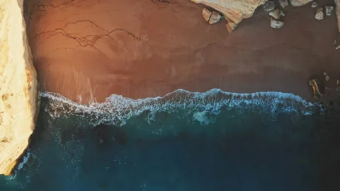 Drone shoots waves hitting the ocean coast area Stock Footage 203595019