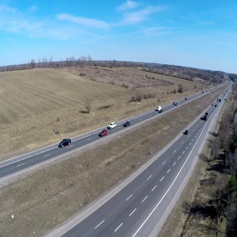Drone shot of a 4 lane divided highway Stock Footage 69732169