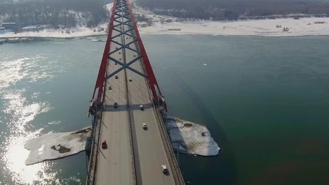 Drone shot 4k camera flying above suspension bridge. traffic cars going across Video stock 105213500